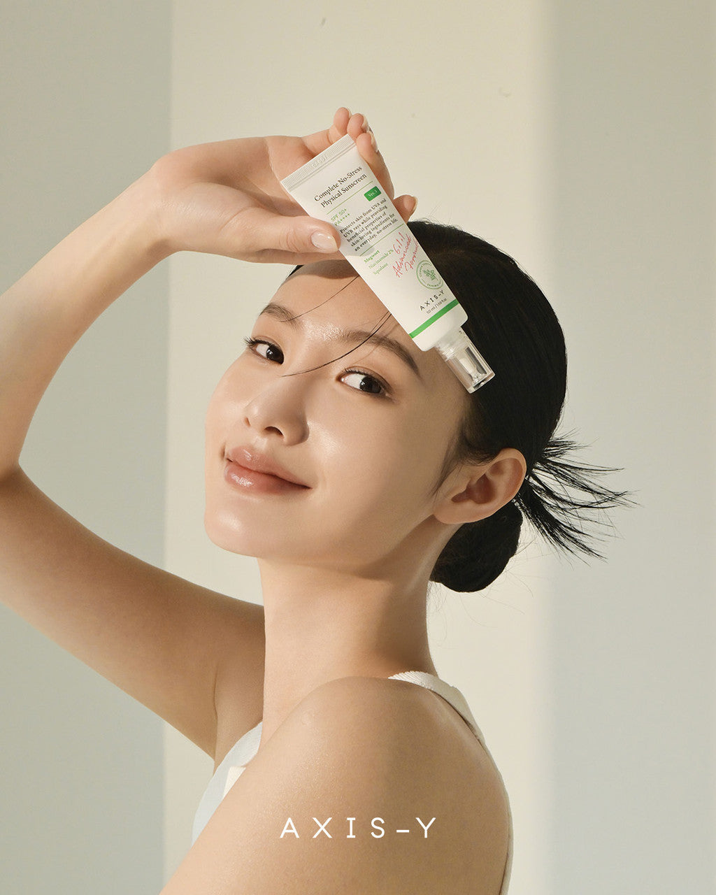 AXIS-Y_Complete_No-Stress_Physical_Sun_Cream_50_mL_KBeauty_Australia_-_model_holding_product__47305.jpg